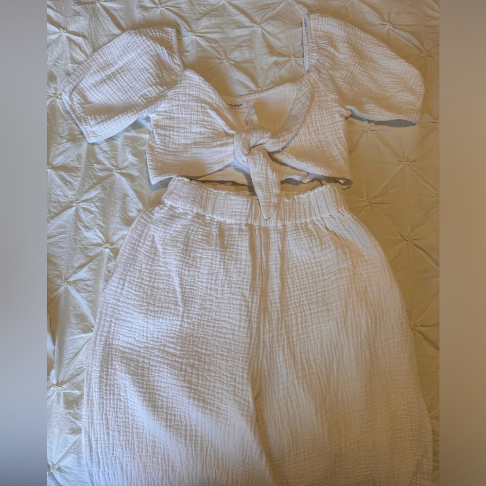 Long pants with matching white top.